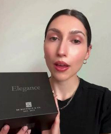 Woman holding up elegance candle